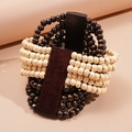 Macro detail of layered wood bead bracelet featuring contrasting coconut shell and dark plates - Creamy White Multi-layer Style