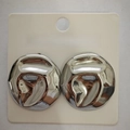 Irregular silver textured stainless steel earrings on jewelry display card - Flat Round / Steel