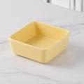 Square yellow ceramic snack bowl with smooth glaze finish on white marble background - Milk Yellow