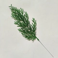 Detail of a green artificial pine branch with glittering gold powder for Christmas decor - Dark Green