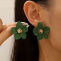 Dark green 5-petal flower earrings with gold center shown on a model's ear - Dark Green Flower Earrings (DZ-644)