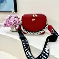 Red square box bag with gold F logo, patterned strap and chunky black and white chain - Red