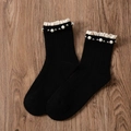 Black ribbed cotton crew socks featuring white lace trim and faux pearl embellishments - One Size / Black