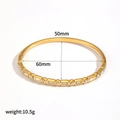 Detail view of 18K gold plated bangle with dimensions 60mm by 50mm and crystal inlays - Geometric Gem Bangle (TB7219)