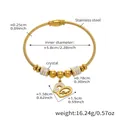 Dettaglio del bracciale in acciaio inossidabile dorato con design a corda e ciondolo a cuore - Stile Cavo Con Ciondolo a Cuore (Z257) / Oro