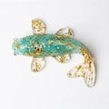 Handcrafted teal crystal resin koi fish figurine with gold foil flakes on white background - Aquamarine