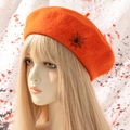 Orange wool beret with black spider web embroidery for Halloween theme on white background - One Size / Orange