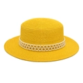 Detailed texture of yellow straw boater hat with elegant white pearl mesh decoration - Yellow