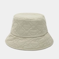 Macro detail of heart-shaped quilting patterns on a beige corduroy bucket hat - M (56-58cm) / Light Green