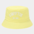 Detailed close-up of white SWIFTIE EST. 1989 embroidery on bright yellow canvas bucket hat - M (56-58cm) / Yellow