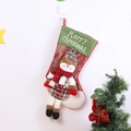 Macro view of festive red Christmas stocking with snowman doll and Merry Christmas embroidery - Snowman Long Leg Christmas Sock