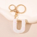 Porte-clés lettre U en résine transparente avec paillettes et anneau doré - Lettre U