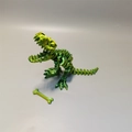3D printed T-Rex fossil skull model in metallic green with articulated jaw and bone accessory - Yellow-Green