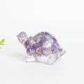 Cute resin turtle ornament filled with natural amethyst crystals on a white background - Dreamy Purple