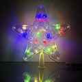 Detailed close-up of a transparent multi-color LED star tree topper on a dark reflective surface - 23cm Five-Point Star Multicolor (2x AA Battery Box)