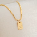 Detailed macro view of 18K gold plated square pendant featuring an engraved letter Z - Letter Z