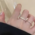 Minimalist silver woven twist ring set for women showing an elegant stacked jewelry look - Plain Band Set