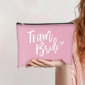 Detailed shot of pink canvas pouch with Team Bride lettering and black zipper closure - Pink Team Bride Heart (jiayingpbb087)