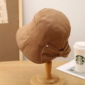 Caramel brown women's bucket hat with elegant bow decoration and metal stud accent - M (56-58cm) / Camel