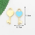 Gold-plated heart key pendant with light blue enamel inlay showing front and back views - Blue Key