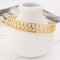 Bracelet jonc doré feuille d'olivier en acier inoxydable avec détails perlés - Doré