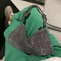 Detailed close-up of sparkling rhinestone handbag with iconic knot handle design - Silver Black