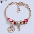 Gold snake chain bracelet with evil eye beads and tree of life charms for women - Red