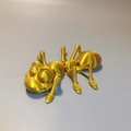 Detailed macro view of 3D printed golden ant toy with articulated legs and PLA texture - Ant / Silk Gold