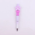Detail of purple gradient beaded pen featuring a silicone flower and heart-shaped beads - Purple Flower