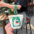 Canvas bucket handbag in cream with green handles and cute rabbit bear cartoon illustration - Spring Rabbit Bear