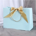 Light blue gift paper bag with a large golden satin bow and woven rope handles - Bowknot Decoration Style / 19x15x7cm / Sky Blue