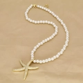 Elegant beaded pearl necklace with starfish and conch pendants on golden satin - Pave Rhinestone Starfish (I)