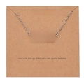 Silver Aries constellation necklace featuring a letter pendant on a kraft paper display card - Silver-Aries