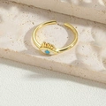 Golden adjustable open ring featuring a blue enamel evil eye with triangle motif - White Enamel Ring