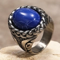 Close-up of vintage steel ring with oval blue textured stone and braided edge detail - US 7 / Steel Dark Blue Turquoise