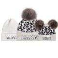 Detailed view of leopard print knit beanies with Papa Mama Mini embroidery and faux fur pom - White-PAPA + Leopard-MAMA + MINI