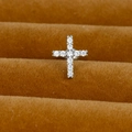 Macro shot of silver stainless steel cross earring with sparkling zircon stone pavé - Silver (Pave Cross Y20412-5)