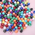 Colorful spherical rhinestone acrylic beads for DIY jewelry making on pink background - 8mm Inner Diamond Colored With Silver (100pcs)