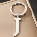 Silver metallic alphabet keychain featuring a polished letter J pendant on a gift box - Letter J