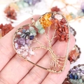 Detail showing a heart-shaped Tree of Life pendant with colorful natural gemstone chips - Gold Heart Tree of Life Pendant