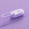 Detail showing the purple pet massage brush with rotating handle and soft fiber cleaning pad - New Rotating Brush Purple