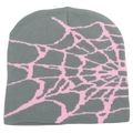 Close-up of the grey beanie featuring pink spider web jacquard knit patterns - One Size / Dusty Pink