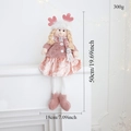 Detail showing dimensions of a pink Christmas plush doll with retractable legs on a shelf - Pink Long Leg Hanging Girl
