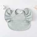 Waterproof baby feeding bib with ruffle sleeves in light sage green with pocket - Wings - Pure Green / One Size