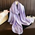 Close-up of lavender silk scarf with smooth texture draped on a hanger with fashion accessories - Light Purple