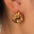 Macro shot of gold-plated triple interlocking hoop earrings with high polish finish - Gold Interlocking Circles (BJGE0734)