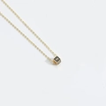 Delicate gold necklace featuring a square cube pendant with engraved letter N - Letter N