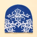 Blue knitted beanie featuring white gothic cross jacquard pattern for winter warmth - One Size / Blue White