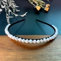 Elegant natural white pearl headband on black metal frame over a rustic wooden background - Pearl / Black