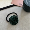 Detailed close-up of dark green velvet rose hair tie with elastic band on soft grey surface - Dark Green